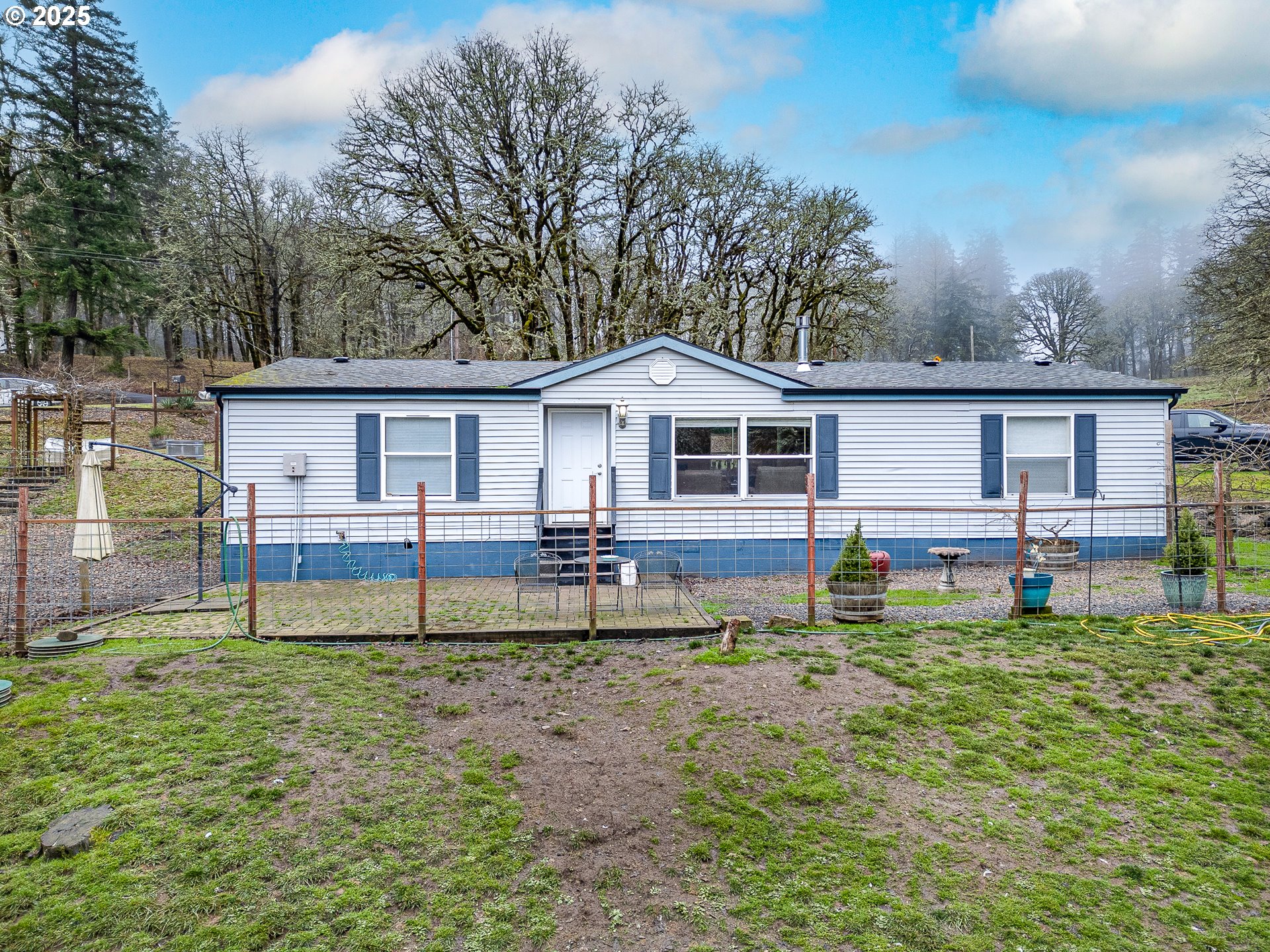 32437 Hidden Valley Road Lebanon, OR 97355 - Photo 1 of 29 a house that has tree in front of it