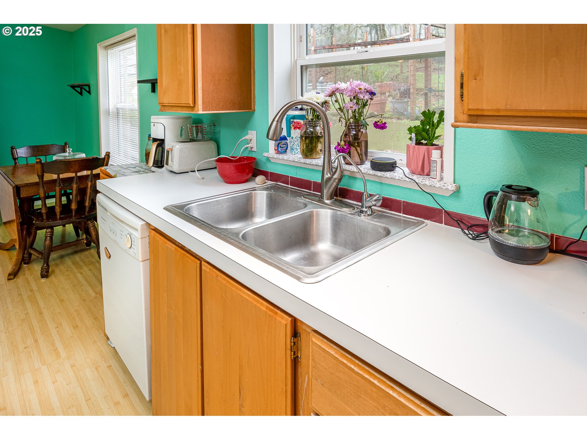 32437 Hidden Valley Road Lebanon, OR 97355 - Photo 11 of 29 a kitchen with a sink and a microwave