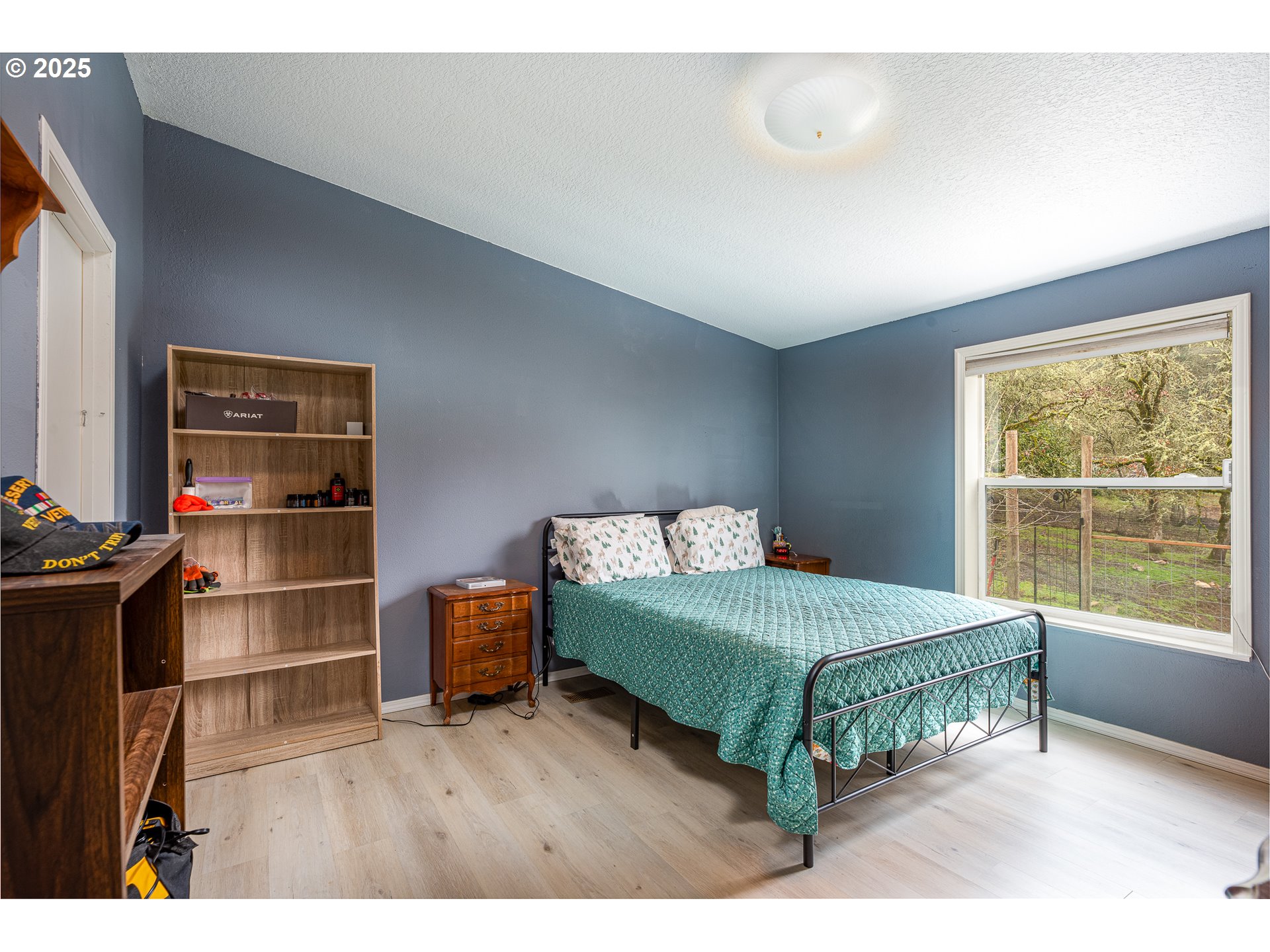 32437 Hidden Valley Road Lebanon, OR 97355 - Photo 15 of 29 a bedroom with a bed and a window