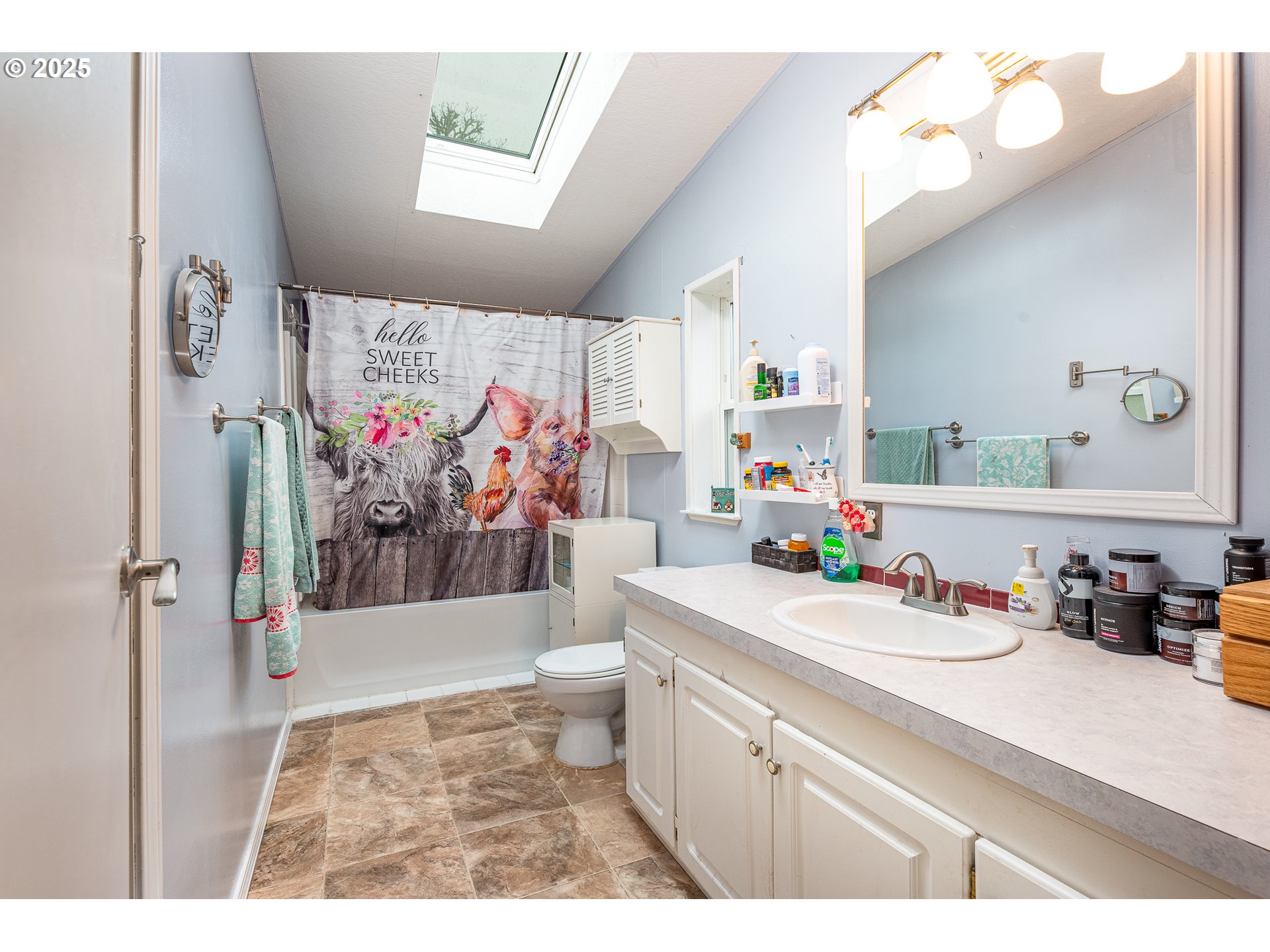 32437 Hidden Valley Road Lebanon, OR 97355 - Photo 17 of 29 a bathroom with a sink mirror and vanity