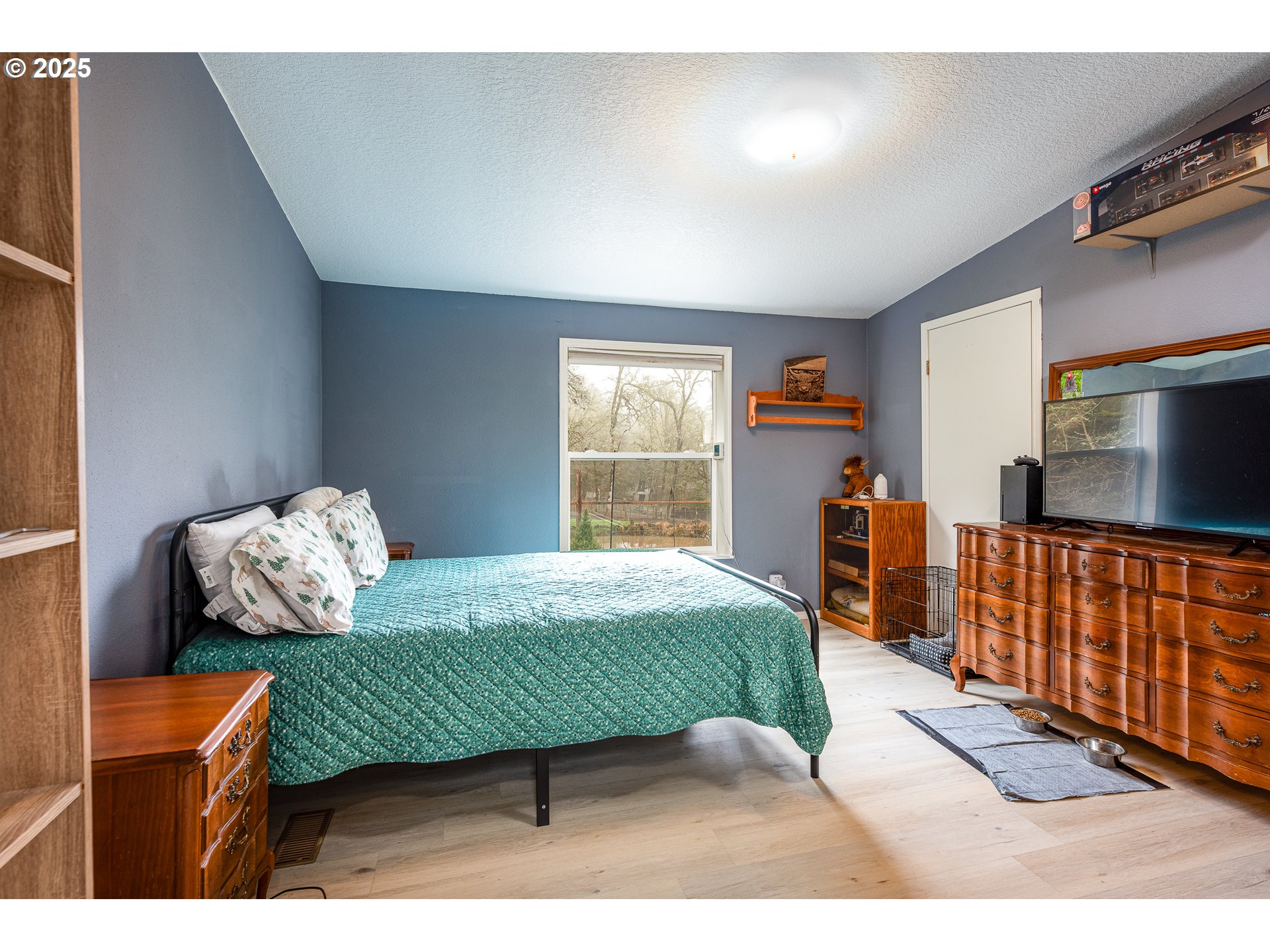 32437 Hidden Valley Road Lebanon, OR 97355 - Photo 18 of 29 a bedroom with furniture and a window