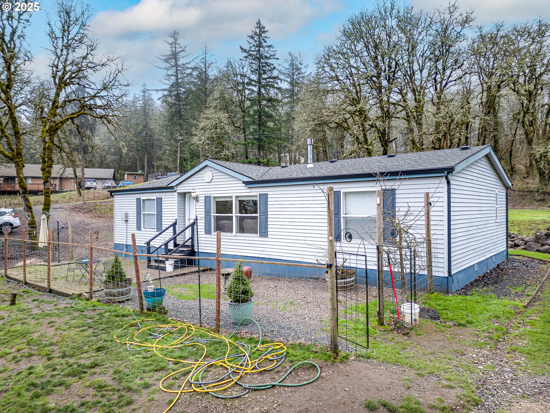 32437 Hidden Valley Road Lebanon, OR 97355 - Photo 2 of 29 a front view of a house with garden
