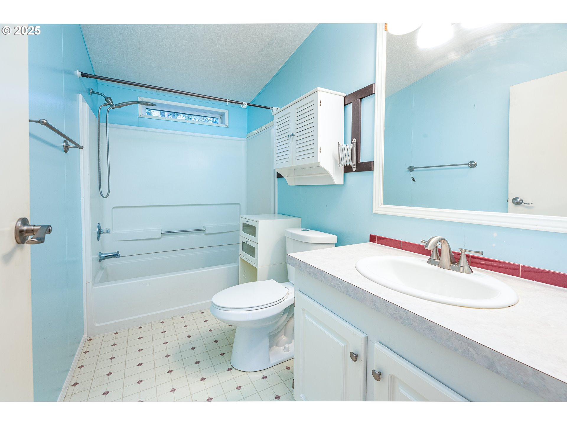 32437 Hidden Valley Road Lebanon, OR 97355 - Photo 22 of 29 a bathroom with a sink toilet a mirror and shower