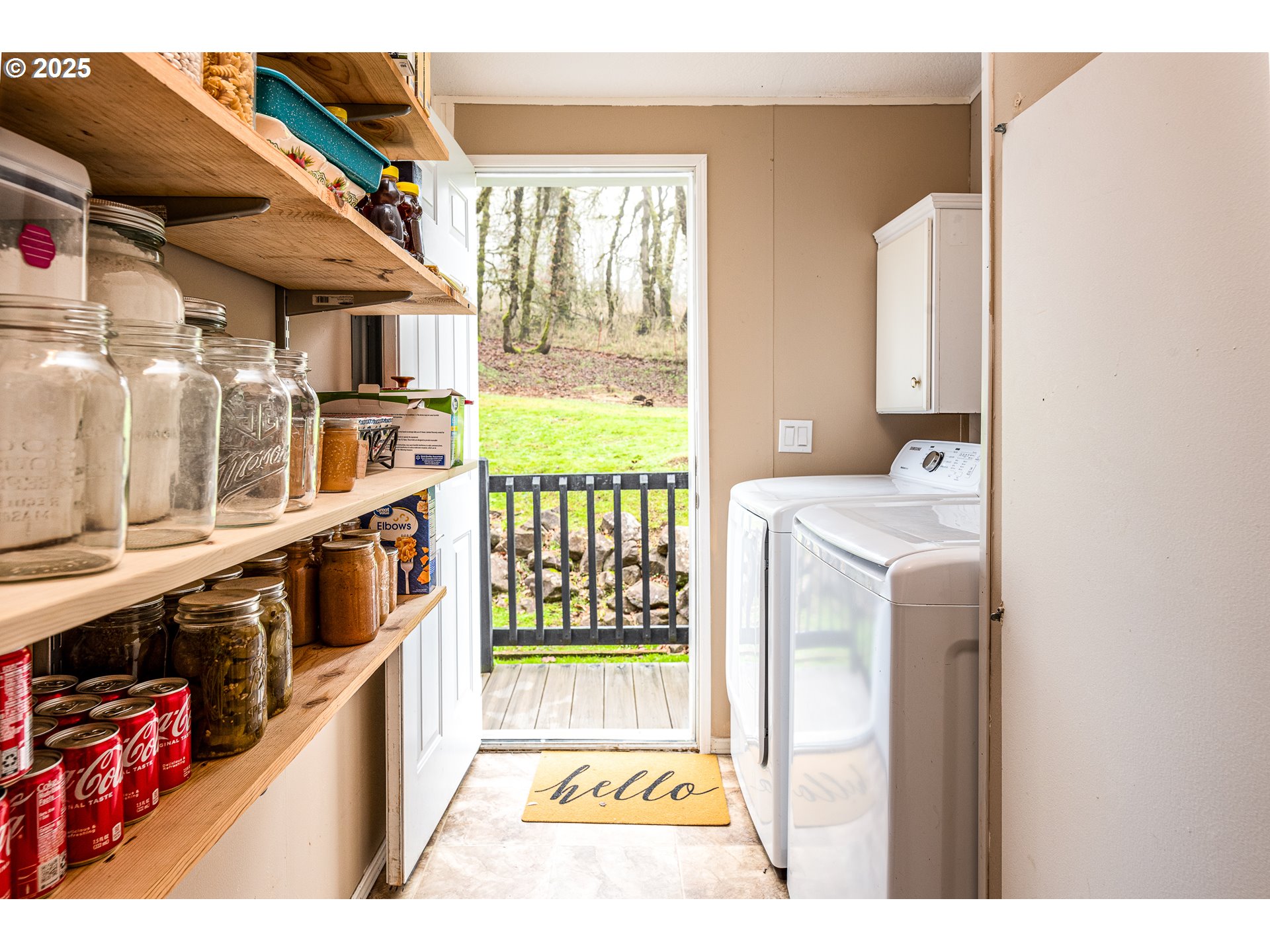 32437 Hidden Valley Road Lebanon, OR 97355 - Photo 23 of 29 a hallway with a washer and dryer
