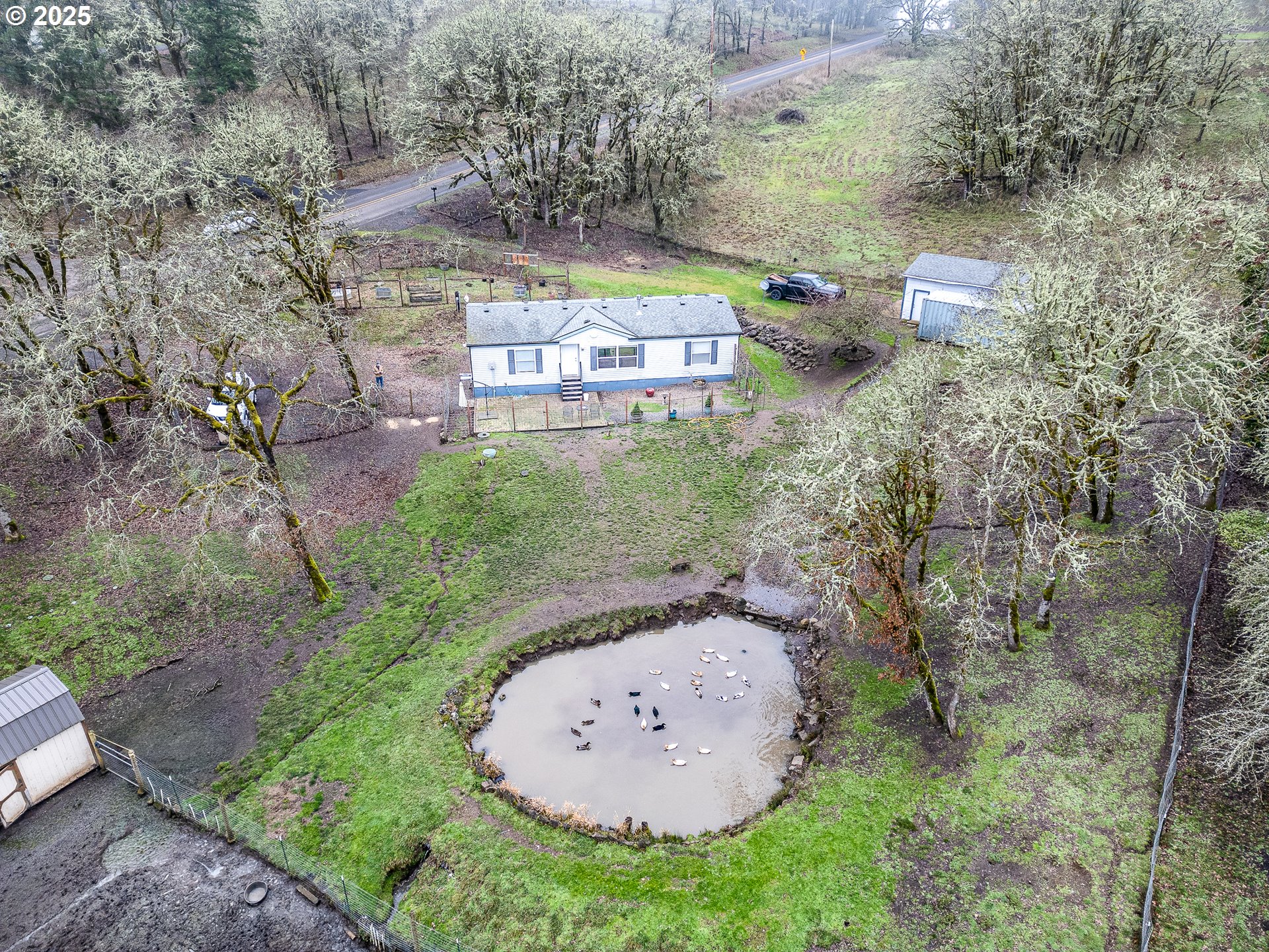 32437 Hidden Valley Road Lebanon, OR 97355 - Photo 27 of 29 an aerial view of a house with a yard and trees