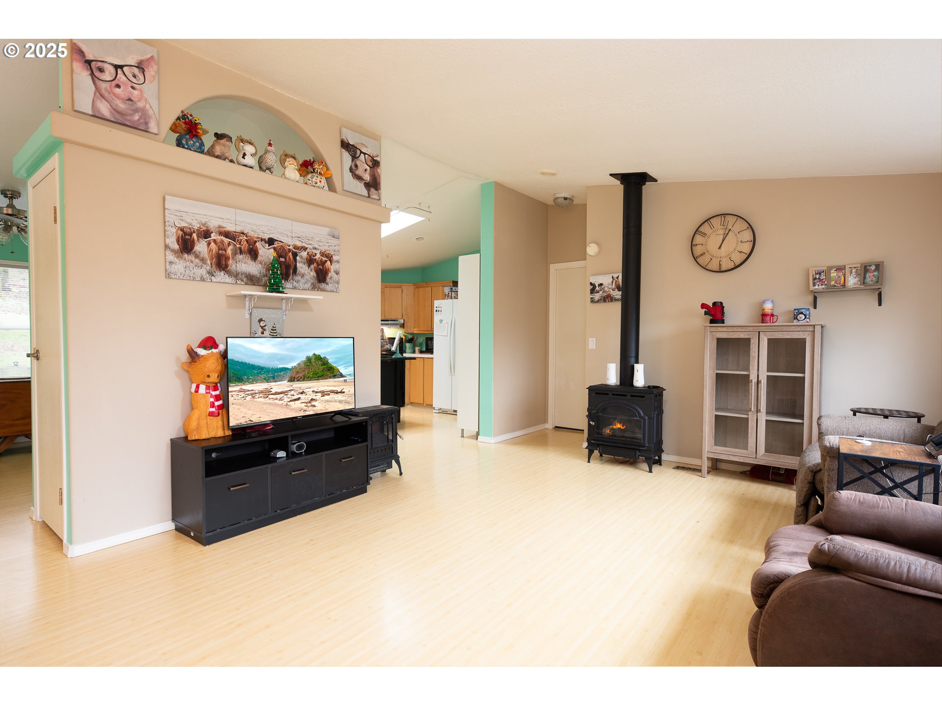32437 Hidden Valley Road Lebanon, OR 97355 - Photo 6 of 29 a living room with furniture and a flat screen tv