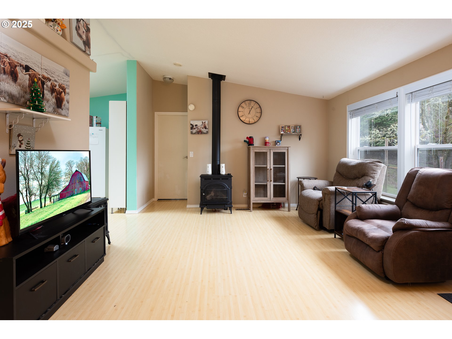32437 Hidden Valley Road Lebanon, OR 97355 - Photo 7 of 29 a living room with furniture and a flat screen tv