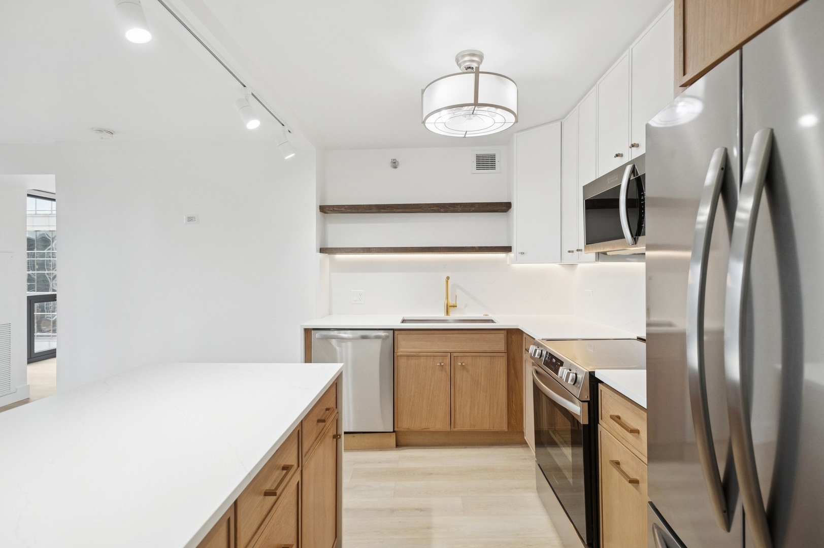 200 North Dearborn Street, Unit 4301 Chicago, IL 60601 - Photo 2 of 21 a kitchen with stainless steel appliances a sink stove and refrigerator
