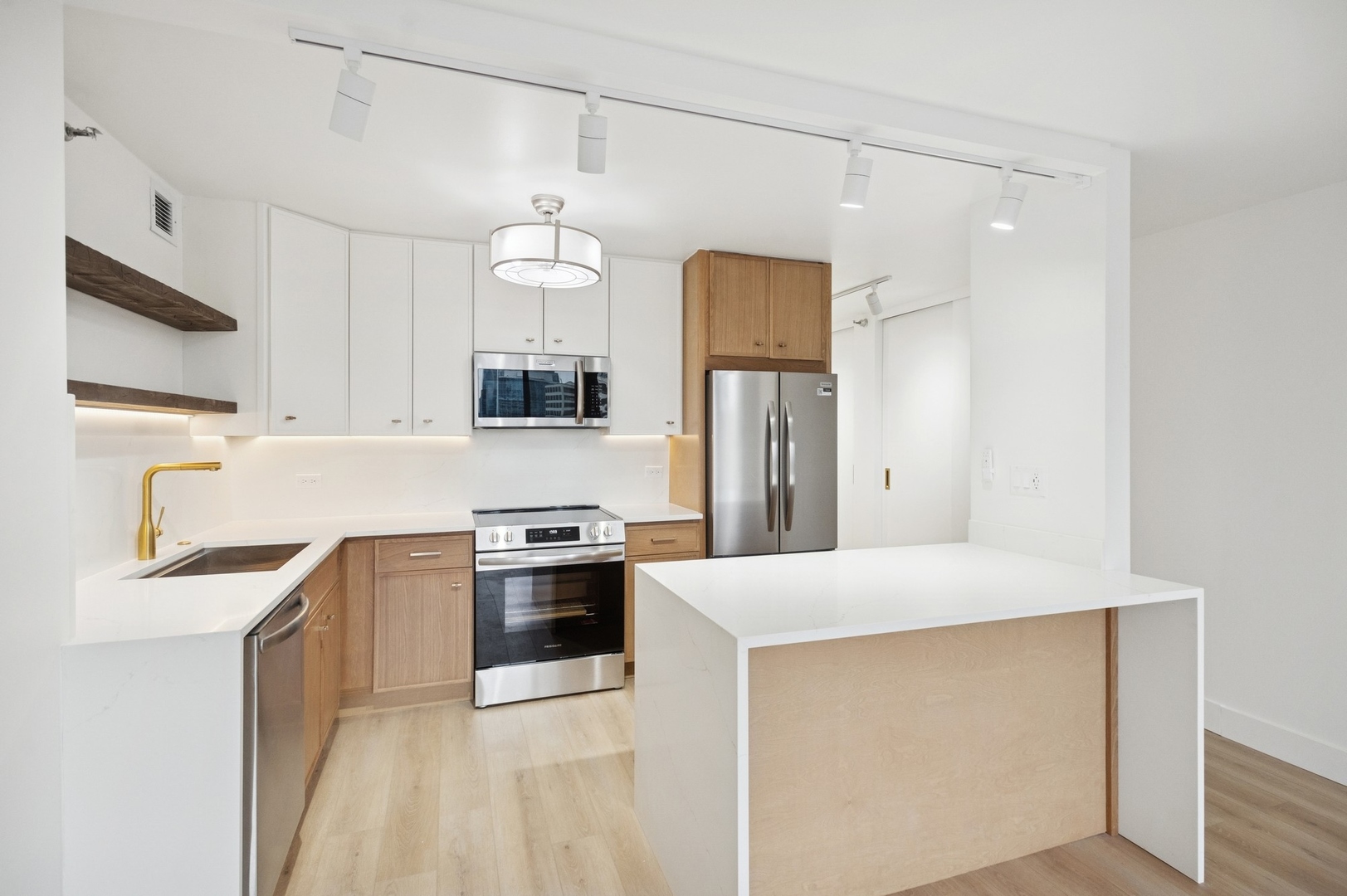 200 North Dearborn Street, Unit 4301 Chicago, IL 60601 - Photo 3 of 21 a kitchen with granite countertop a sink cabinets stainless steel appliances and a counter top space