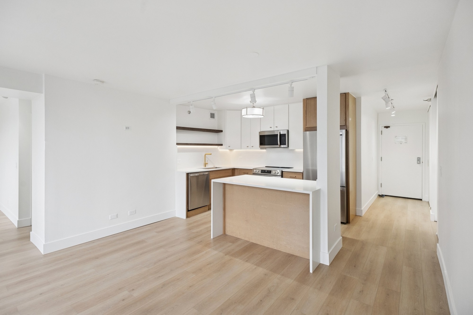 200 North Dearborn Street, Unit 4301 Chicago, IL 60601 - Photo 6 of 21 a kitchen with white cabinets and white appliances