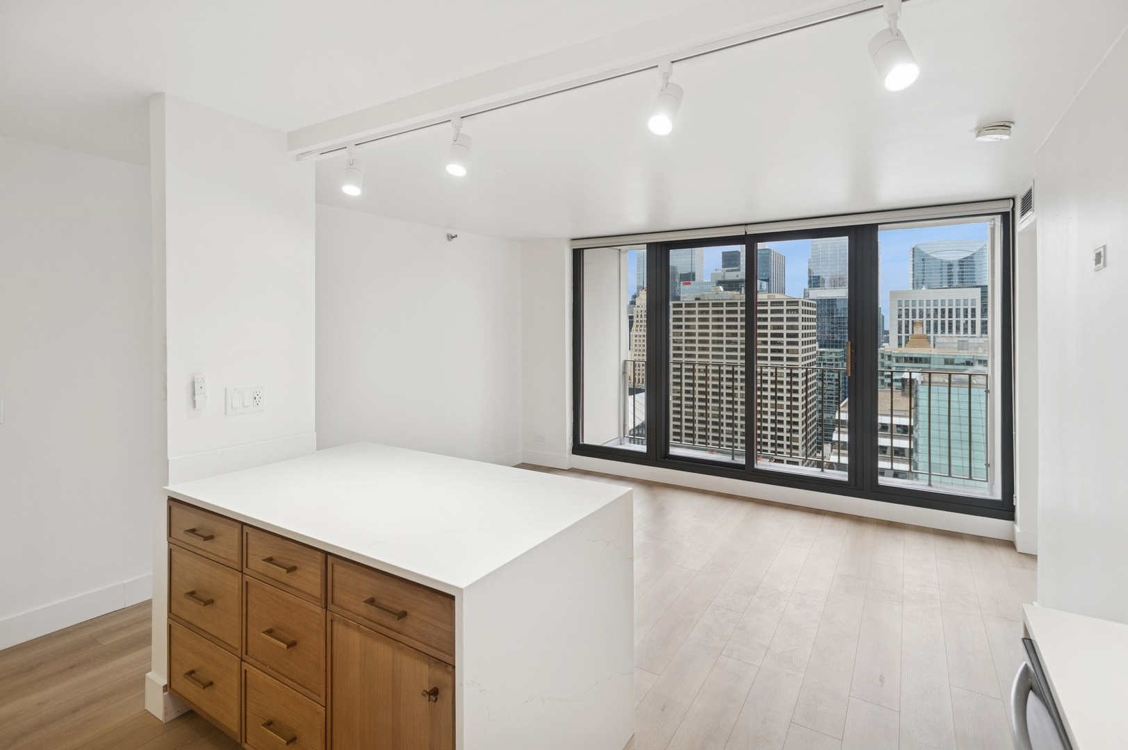 200 North Dearborn Street, Unit 4301 Chicago, IL 60601 - Photo 7 of 21 a view of an empty room with cabinet and wooden floor