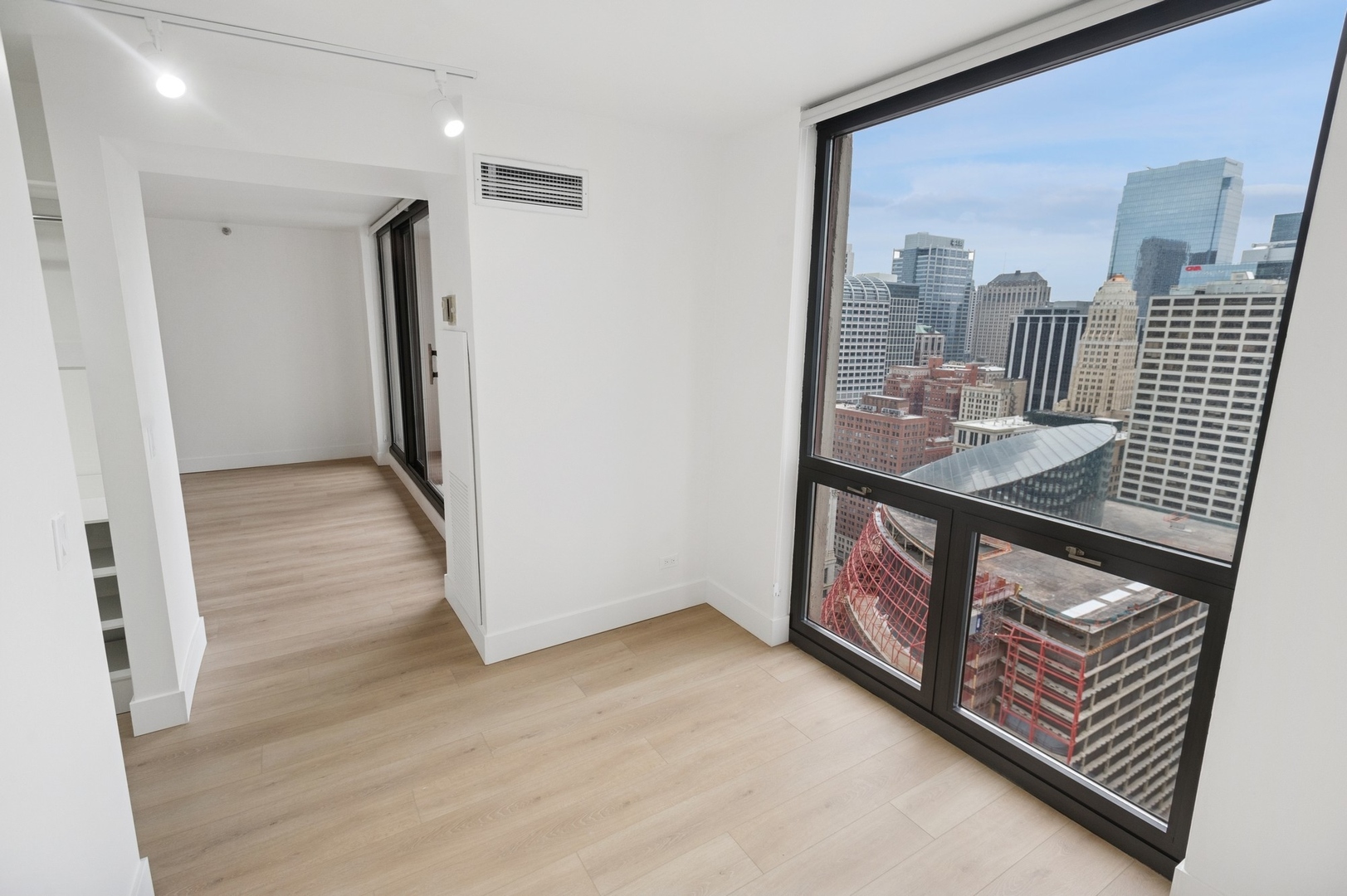 200 North Dearborn Street, Unit 4301 Chicago, IL 60601 - Photo 10 of 21 a view of hallway with furniture and wooden floor