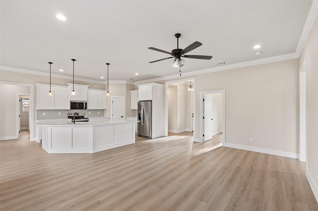 506 Limestone Circle Mabank, TX 75147 - Photo 6 of 33 a view of kitchen with stainless steel appliances kitchen island wooden floors