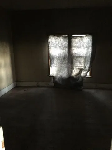 a view of room with window and a floor to ceiling window