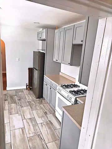 a kitchen with a stove a refrigerator and a stove