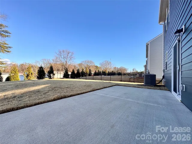 a view of a road with a building in the background