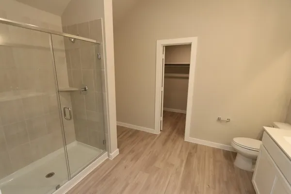 a bathroom with a shower and a toilet