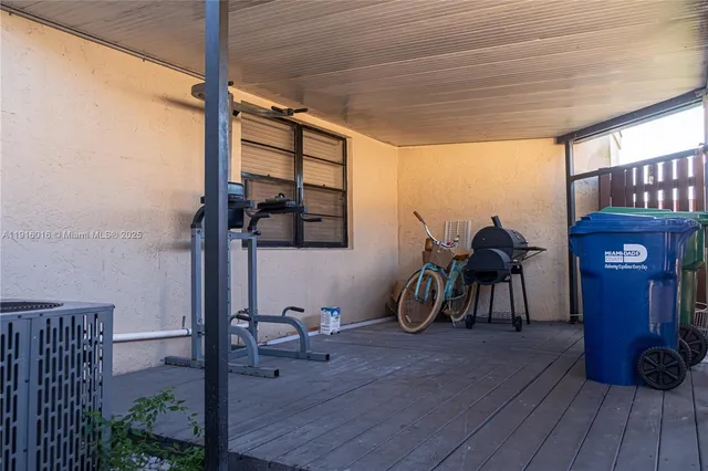 a view of a room with furniture wooden floor and windows
