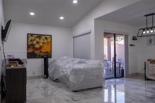 a bedroom with bed and window