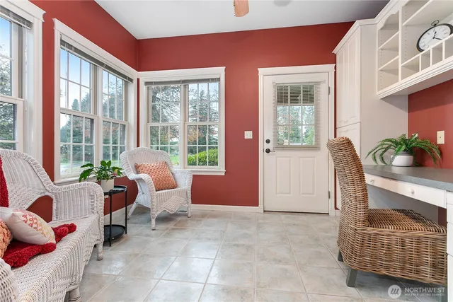 a living room with furniture and windows