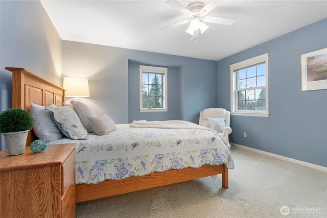 a bedroom with a bed and window