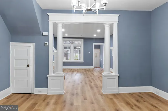 a view of an empty room and wooden floor
