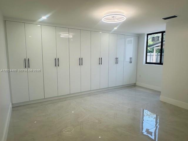 11870 Southwest 5th Street, Unit A Miami, FL 33184 - Photo 12 of 18 a view of an empty room and a window