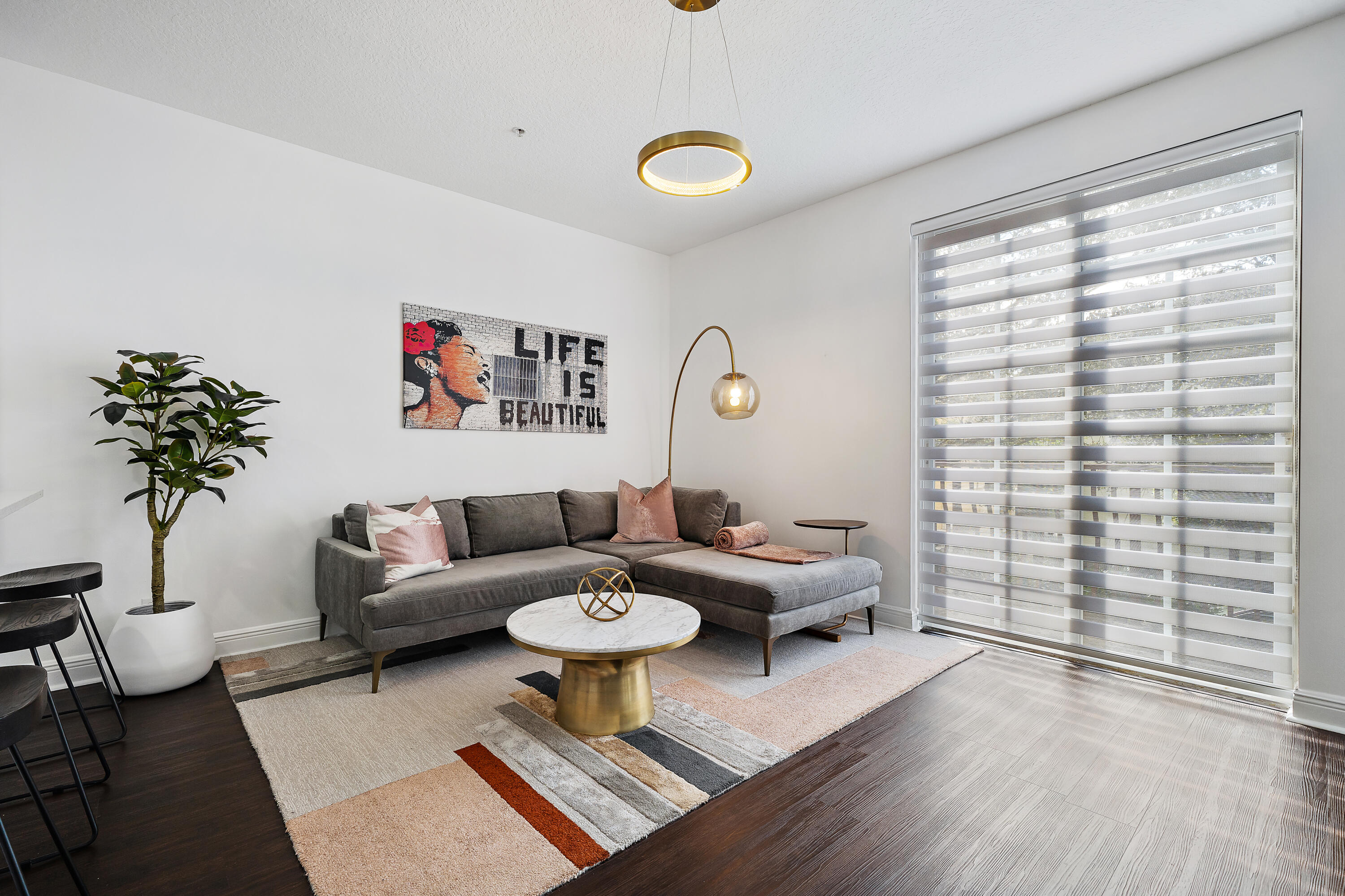 113 West Indian Crossing Circle Jupiter, FL 33458 - Photo 19 of 38 a living room with furniture and a potted plant
