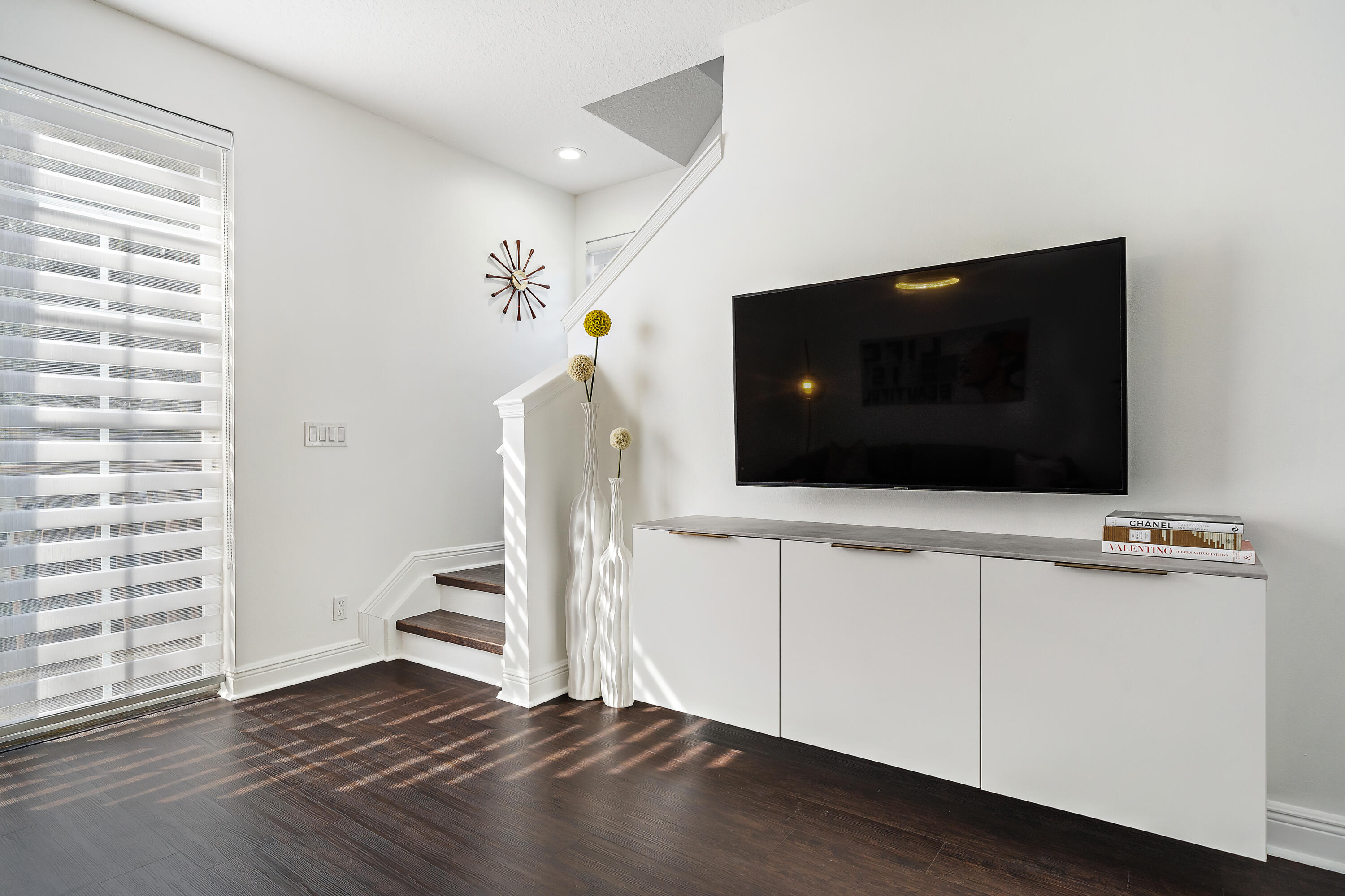 113 West Indian Crossing Circle Jupiter, FL 33458 - Photo 20 of 38 a living room with a flat screen tv and a fireplace