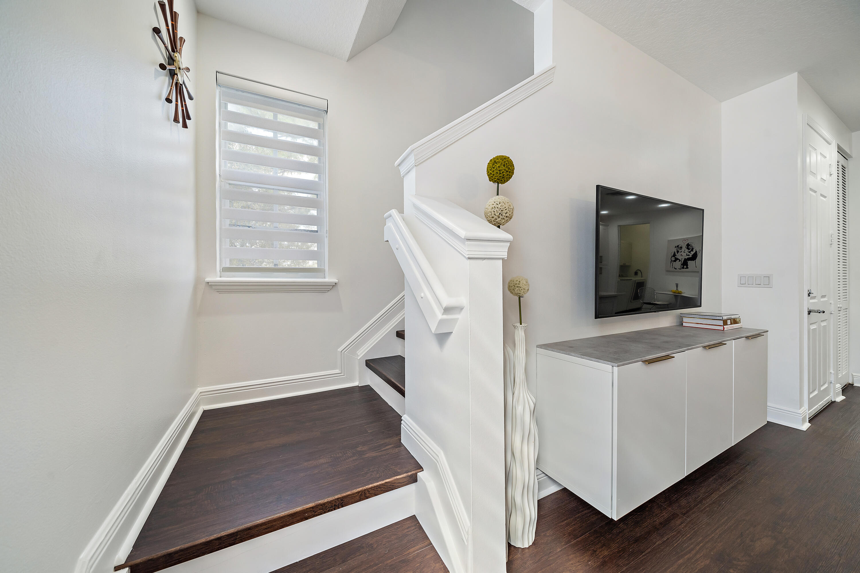 113 West Indian Crossing Circle Jupiter, FL 33458 - Photo 22 of 38 a living room with furniture and a flat screen tv