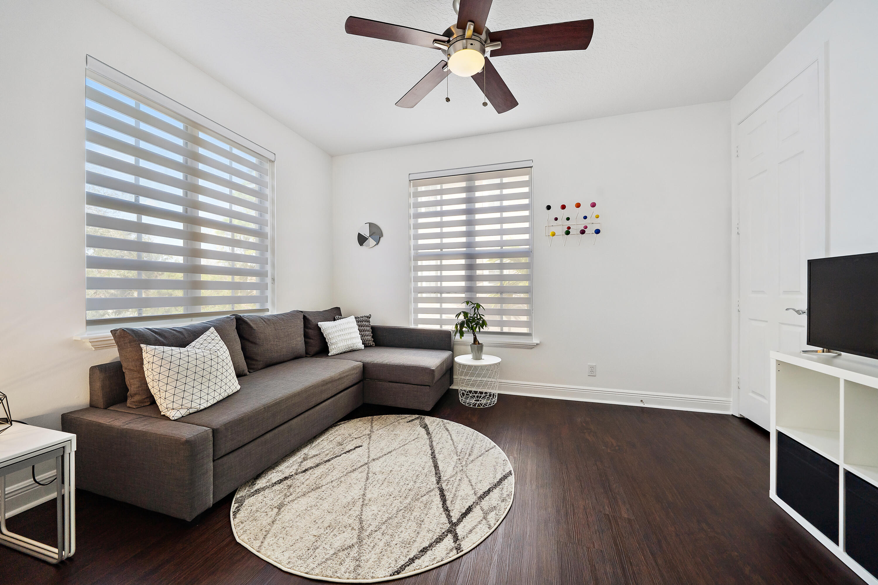 113 West Indian Crossing Circle Jupiter, FL 33458 - Photo 23 of 38 a living room with furniture and a wooden floor