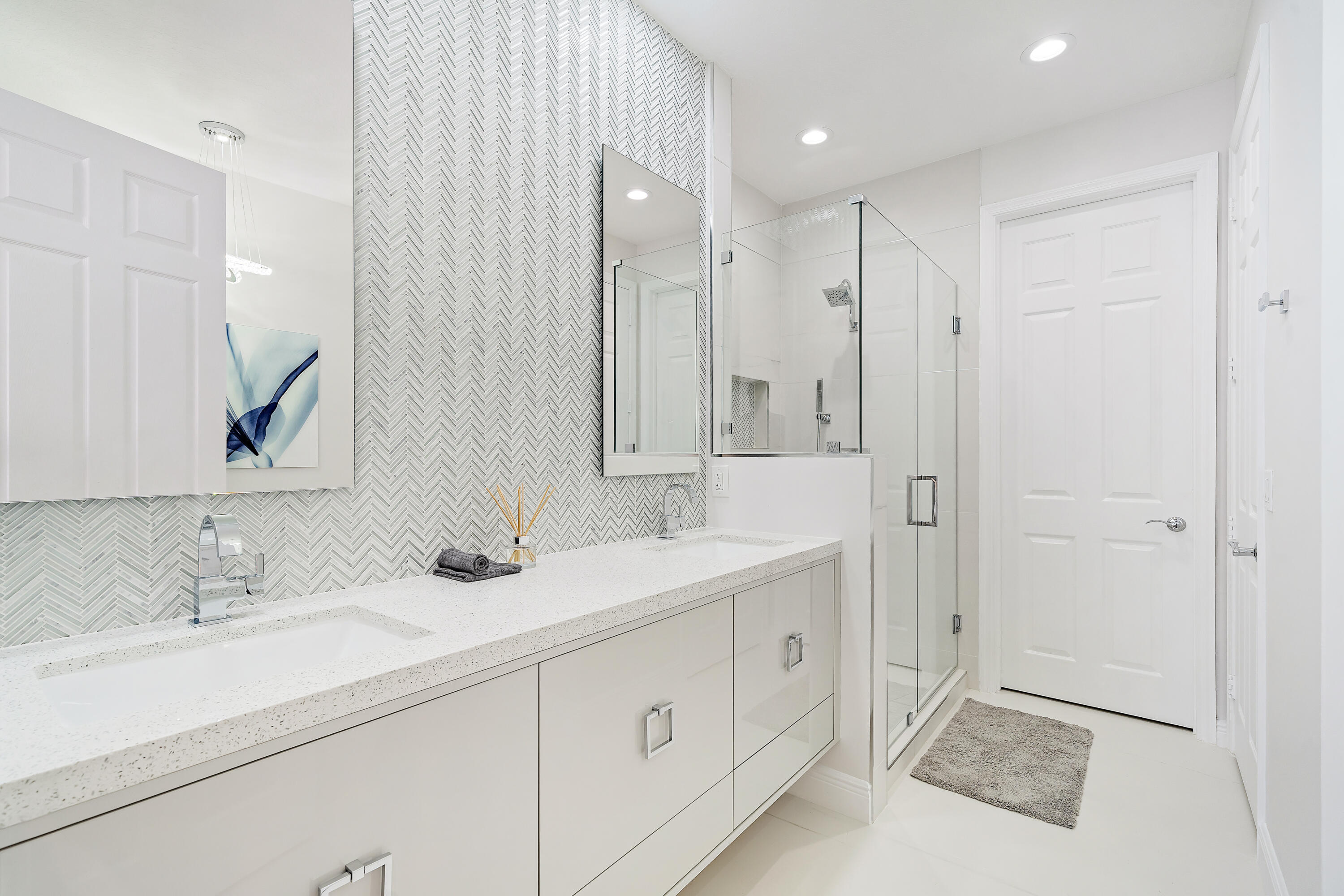 113 West Indian Crossing Circle Jupiter, FL 33458 - Photo 29 of 38 a bathroom with a double vanity sink mirror and