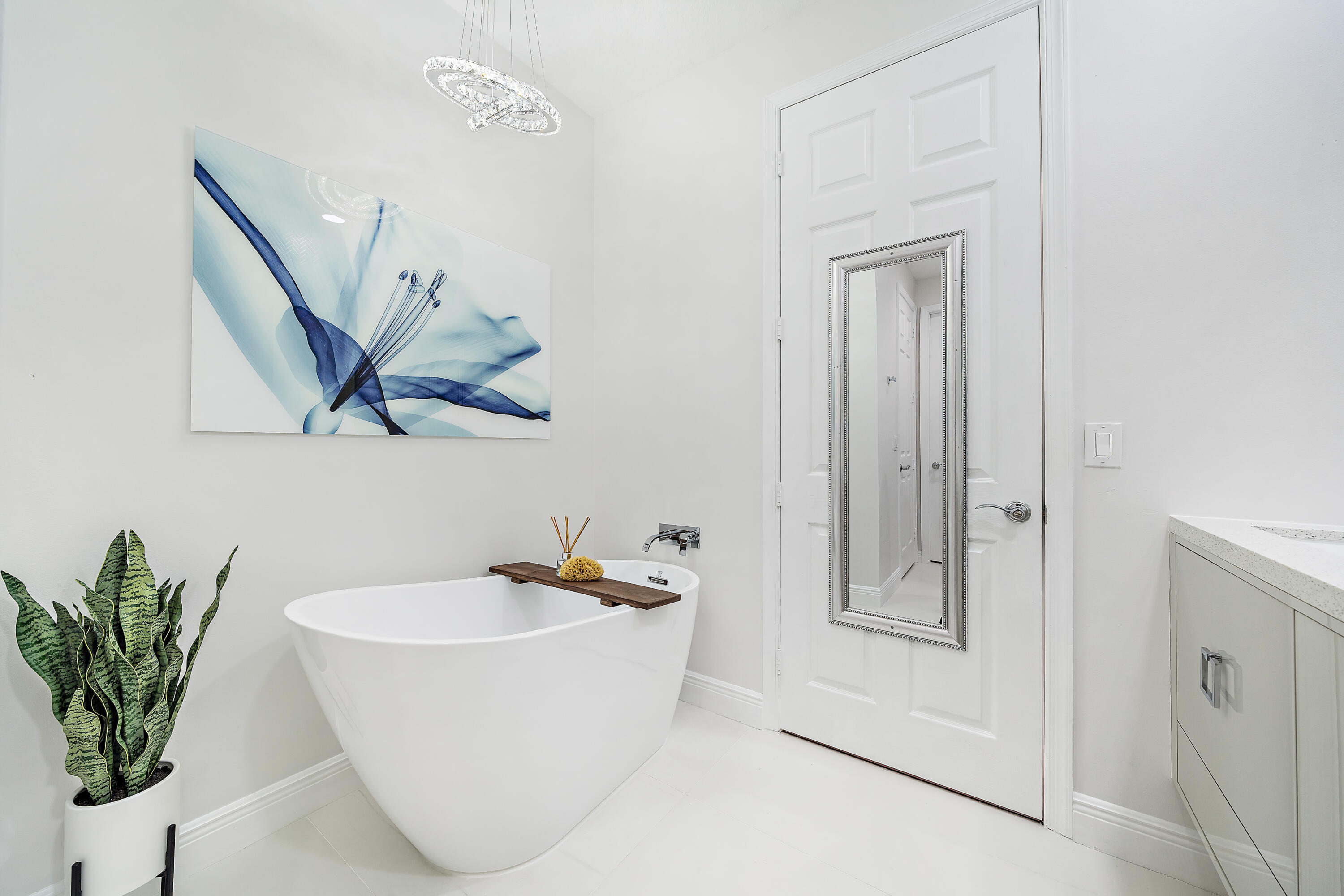 113 West Indian Crossing Circle Jupiter, FL 33458 - Photo 32 of 38 a white bath tub sitting next to a white sink