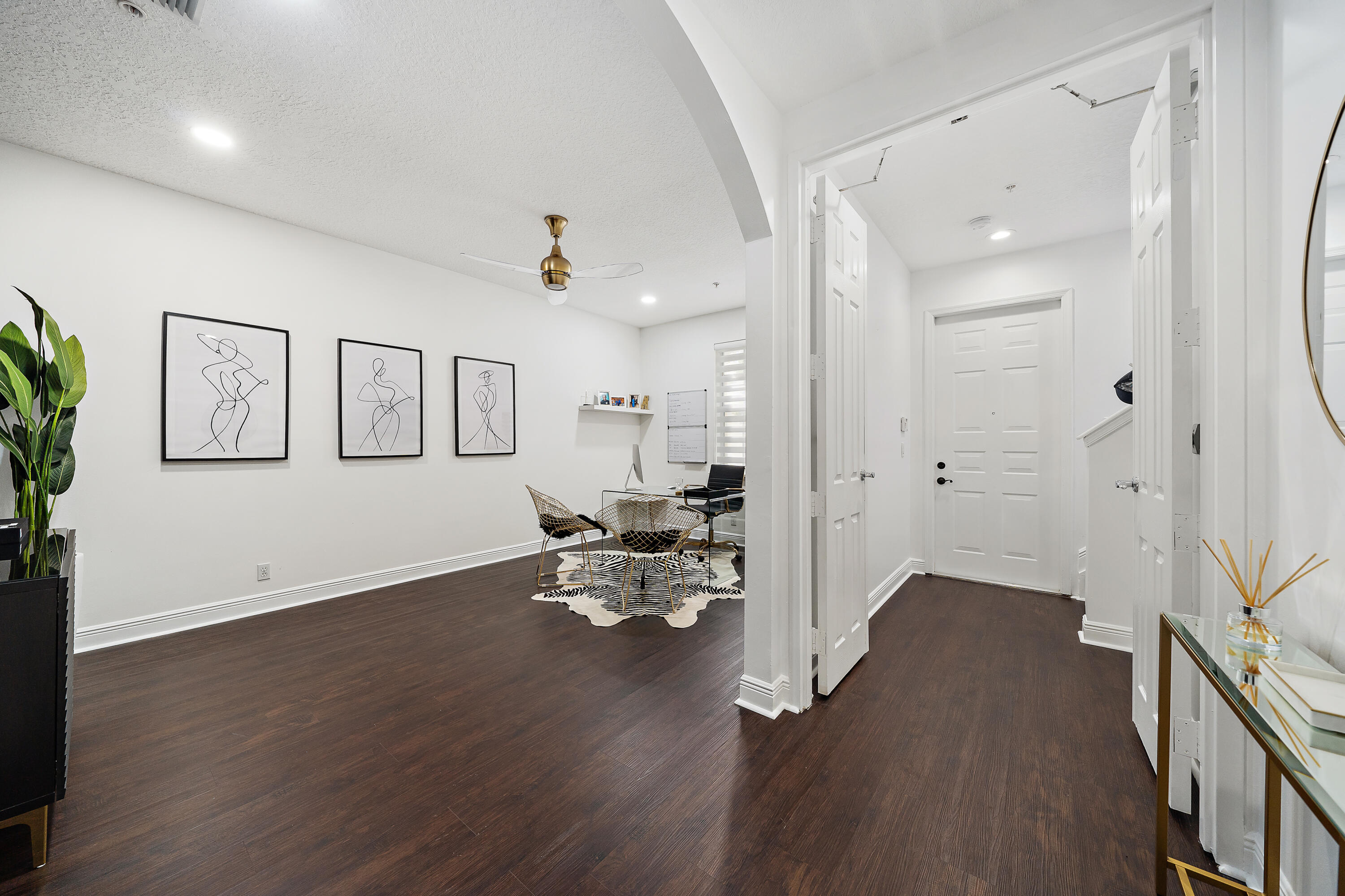 113 West Indian Crossing Circle Jupiter, FL 33458 - Photo 5 of 38 a view of a room with wooden floor and furniture
