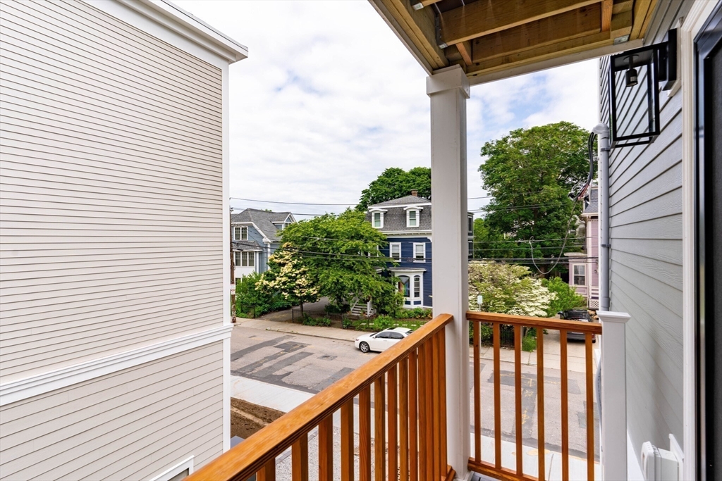 285 Lamartine Street, Unit 2 Boston, MA 02130 - Photo 5 of 13 a view of a balcony with a tree