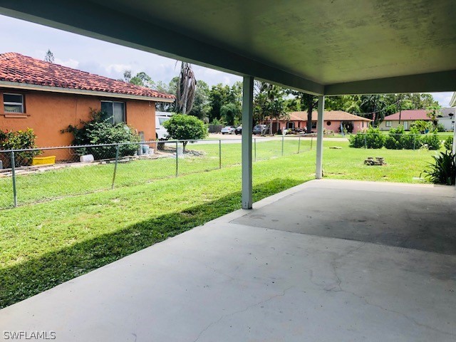 18577 Iris Road Fort Myers, FL 33967 - Photo 13 of 16 a view of a house with backyard and a garden