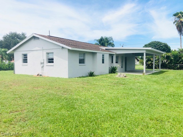 18577 Iris Road Fort Myers, FL 33967 - Photo 14 of 16 a front view of house with yard and green space