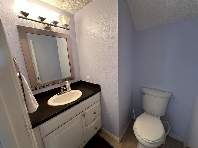 a bathroom with a toilet a sink and a shower