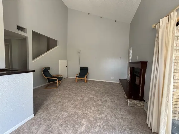 a bedroom with furniture and a flat screen tv