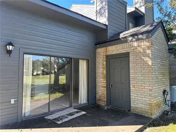 a view of backyard with large window