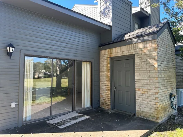 a view of backyard with large window