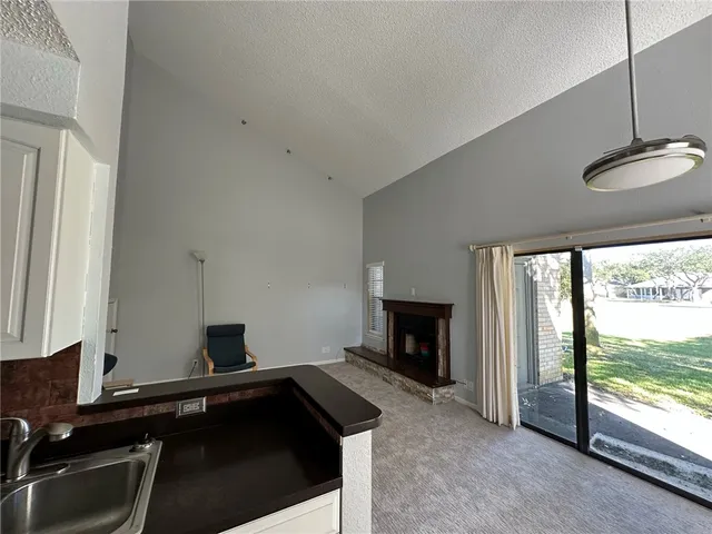 a kitchen with a sink and a stove