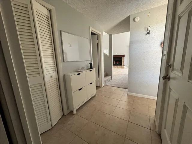 a bathroom with a granite countertop shower and a sink