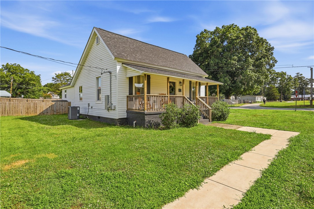1 Brock Street Pelzer, SC 29669 - Photo 25 of 25 A welcoming front porch enhances this charming bungalow with a spacious yard.
