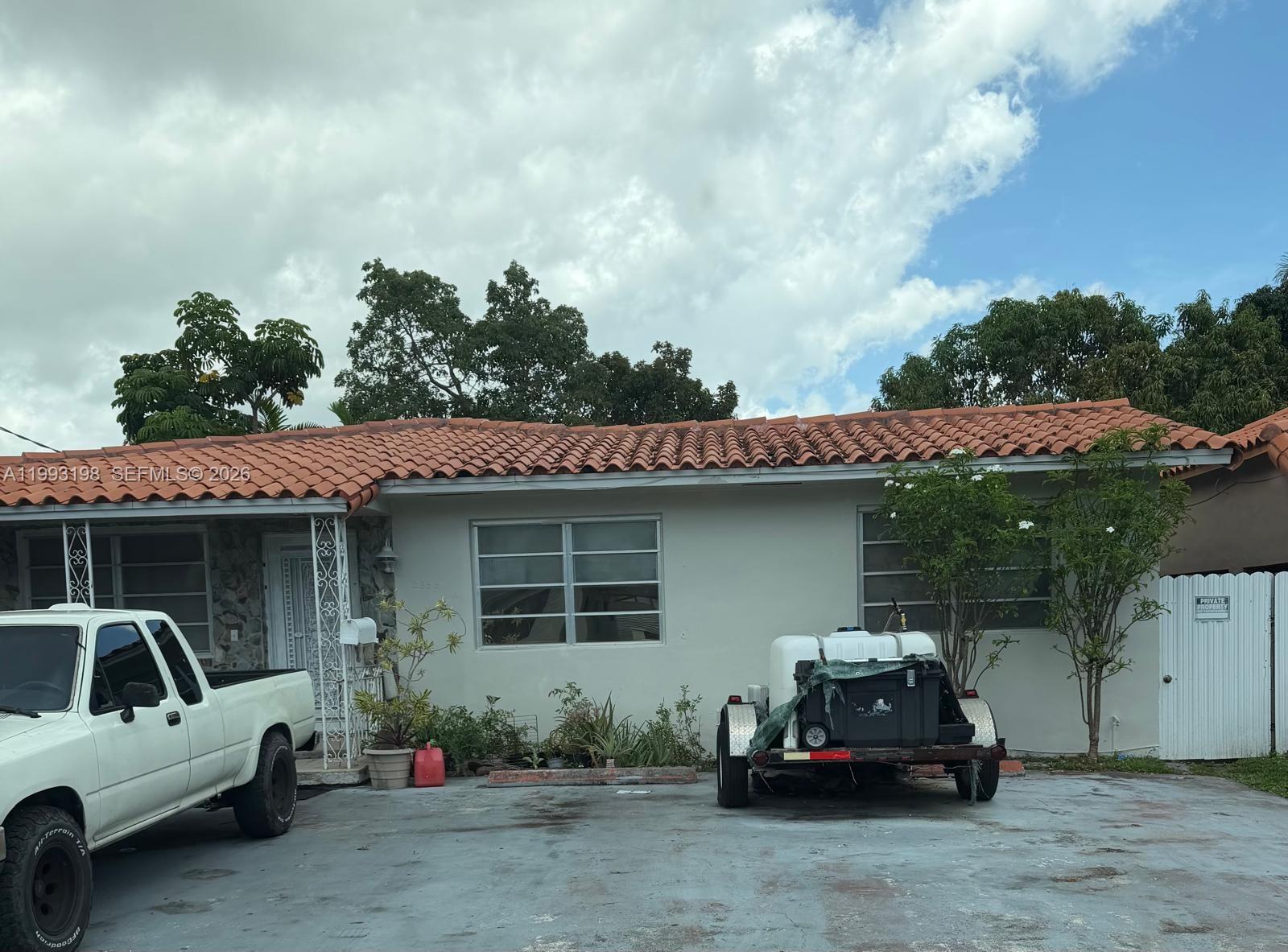 2353 Southwest 2nd Street Miami, FL 33135 - Photo 1 of 7 a car parked in front of a house