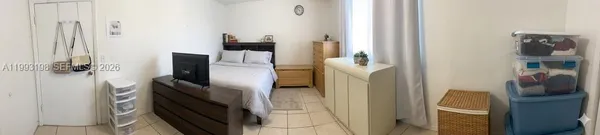 a kitchen with a refrigerator and a stove