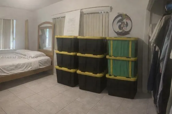 a bedroom with a bed and a closet in it