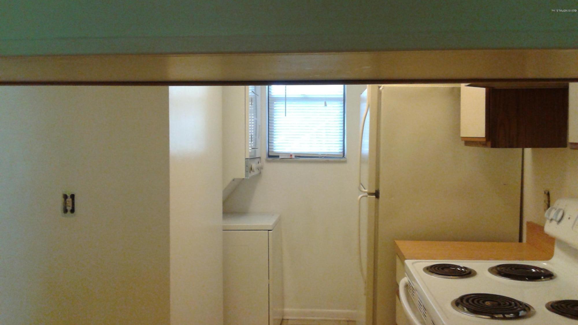 650 West Pope Road, Unit 258 St. Augustine, FL 32080 - Photo 4 of 13 kitchen with washer and dryer