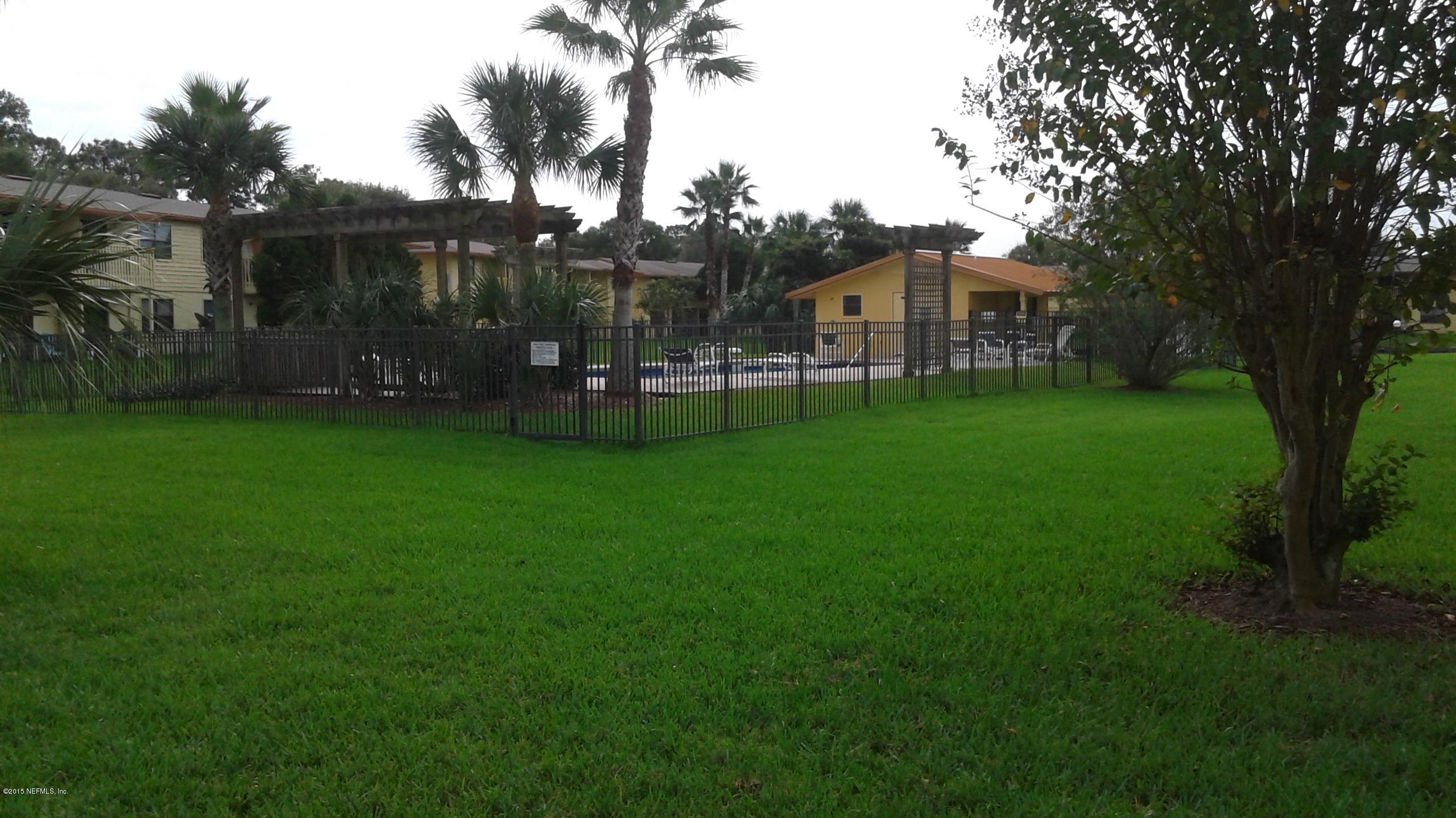 650 West Pope Road, Unit 258 St. Augustine, FL 32080 - Photo 10 of 13 Back yard view of community pool