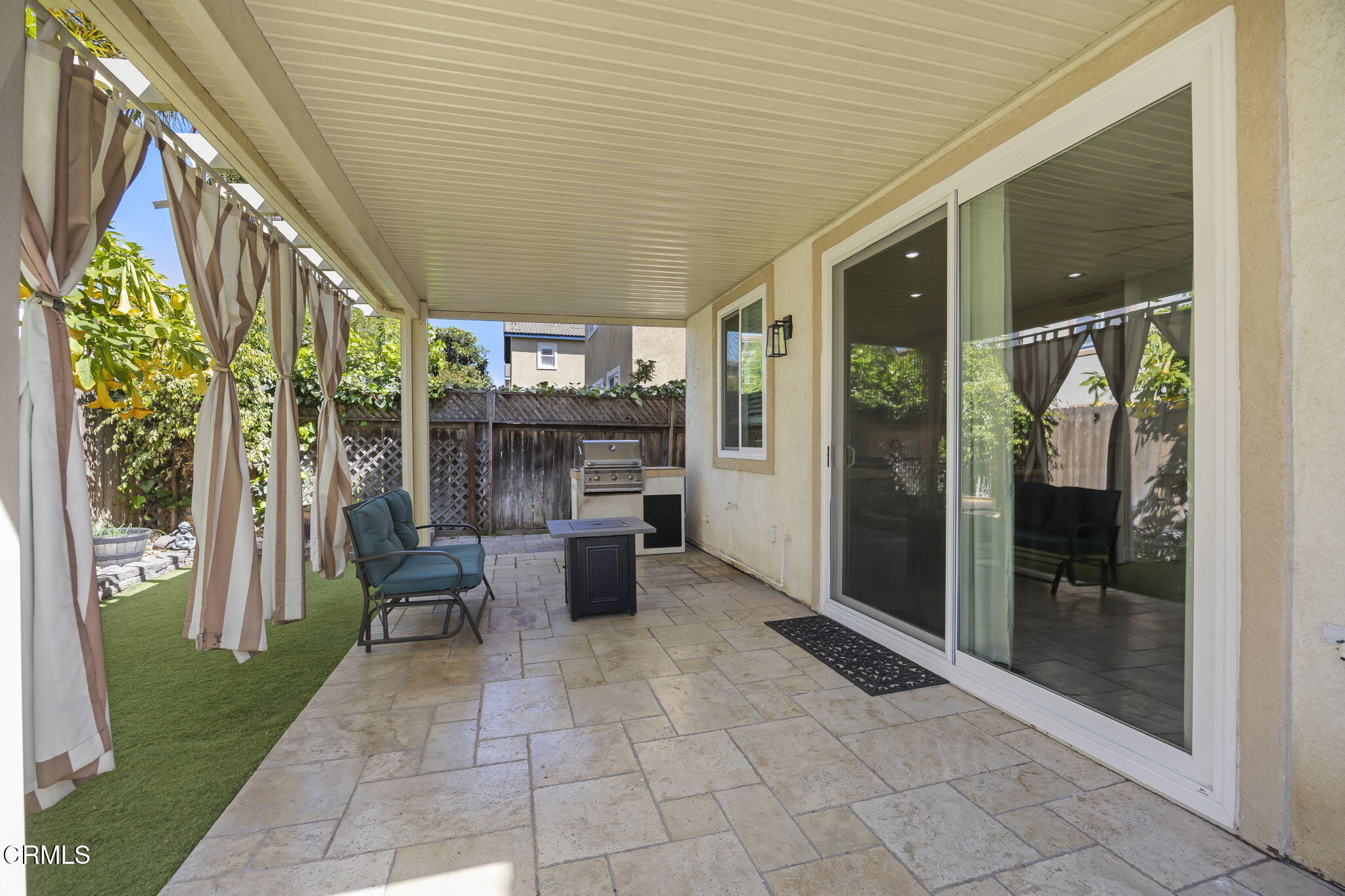 803 Noontide Way Oxnard, CA 93035 - Photo 18 of 44 a view of a patio with a table and chairs and potted plants